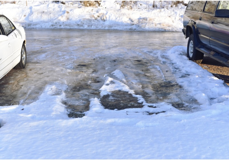 Icy Parking lot in Nashville Tennessee that will have infrared asphalt patching services on it