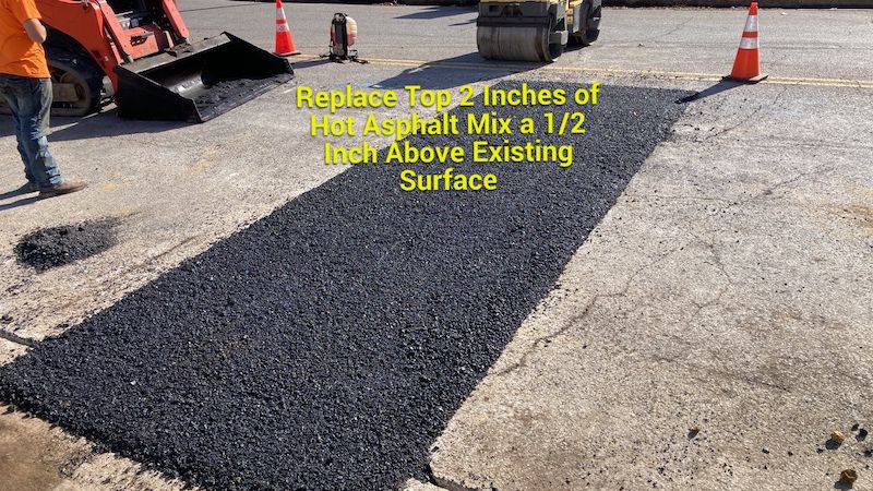 Asphalt replacement Nashville TN. Asphalt contractors case study image explaining that replaced the top two inches of hot asphalt mix a 1/2 inch above existing surface in Davidson County