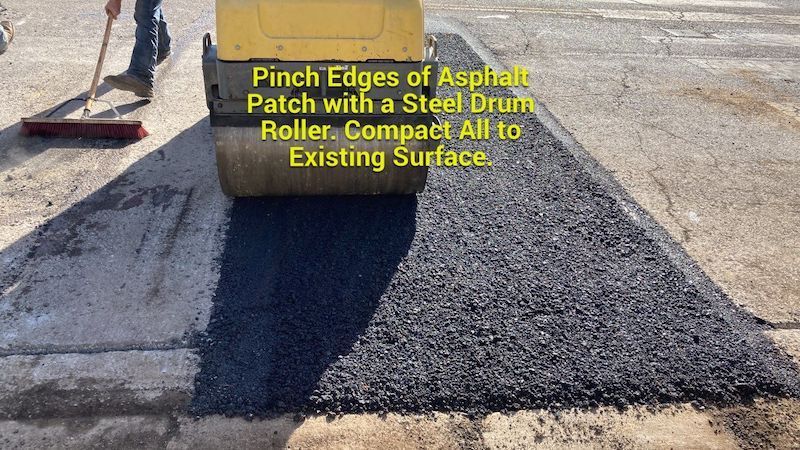 Hot asphalt trench repair in Nashville. Asphalt Contractors Case study showing the process of Pinch Edges of asphalt patch with a steel drum roller, compacting all to the existing surface