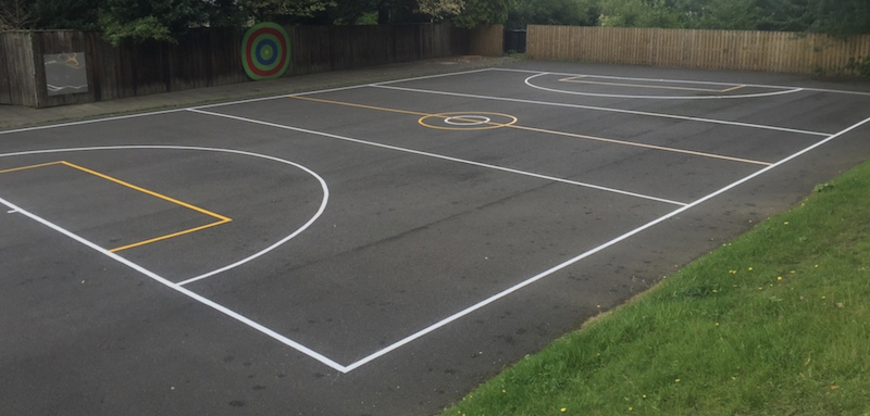 Preformed thermoplastic pavement markings for a recreational play area for a Davidson County, TN Montessori School