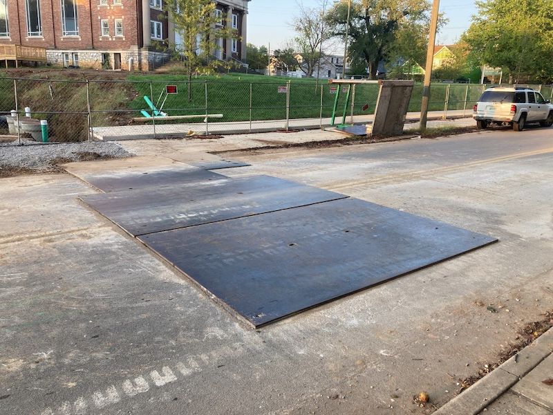 Nashville Plumber took photo of steel trench plates for asphalt contractor to show he to come do a permanent asphalt pack