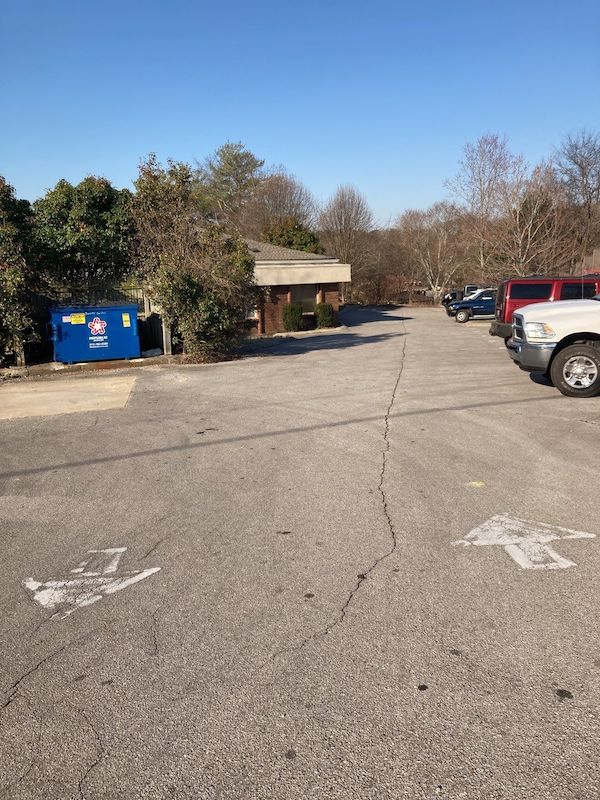 Photo of a parking lot with longitudinal Cracking in need of asphalt patching in West Nashville