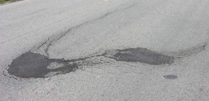 Image of slippage cracks in asphalt that in in need of asphalt patching in West Nashville, TN