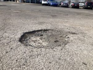 image of a parking lot in Nashville TN that needs asphalt patching