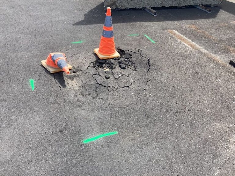 Image is from a possible slip and fall parking lot settlement in Nashville Tennessee. Parking Lot repair is needed for this Nashville business